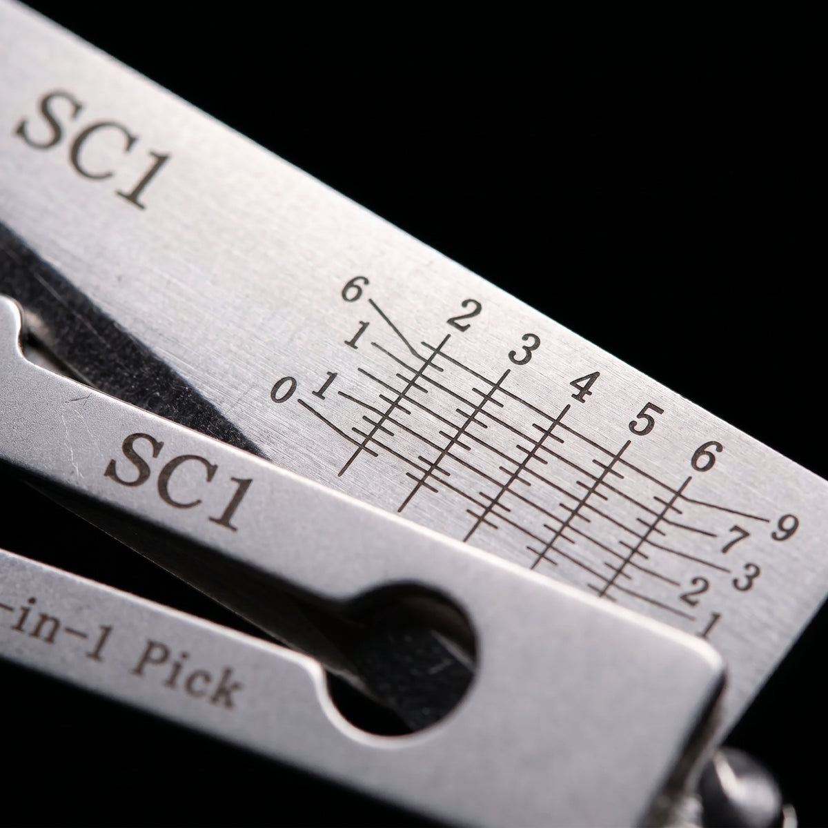 Extreme close-up of laser-etched SC1 bitting scale with numbered depth markings